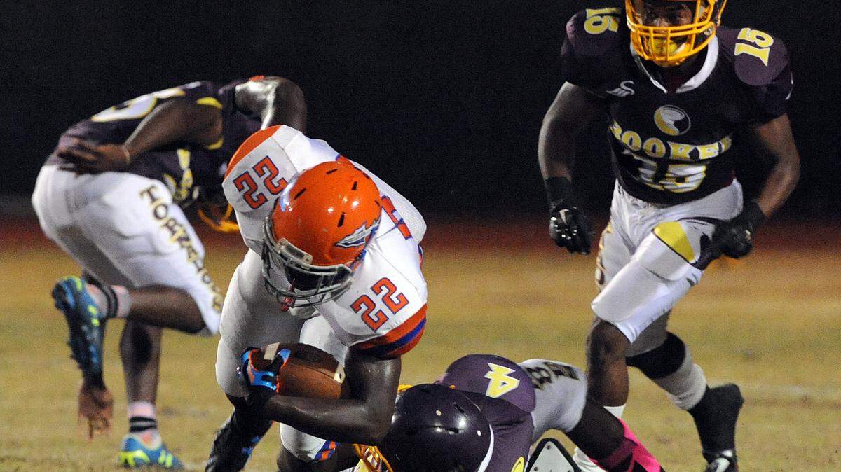 Southeast's Teriq Houston fights Booker's defense during their game Friday night against Booker in Sarasota. 
 TIFFANY TOMPKINS-CONDIE/Bradenton Herald