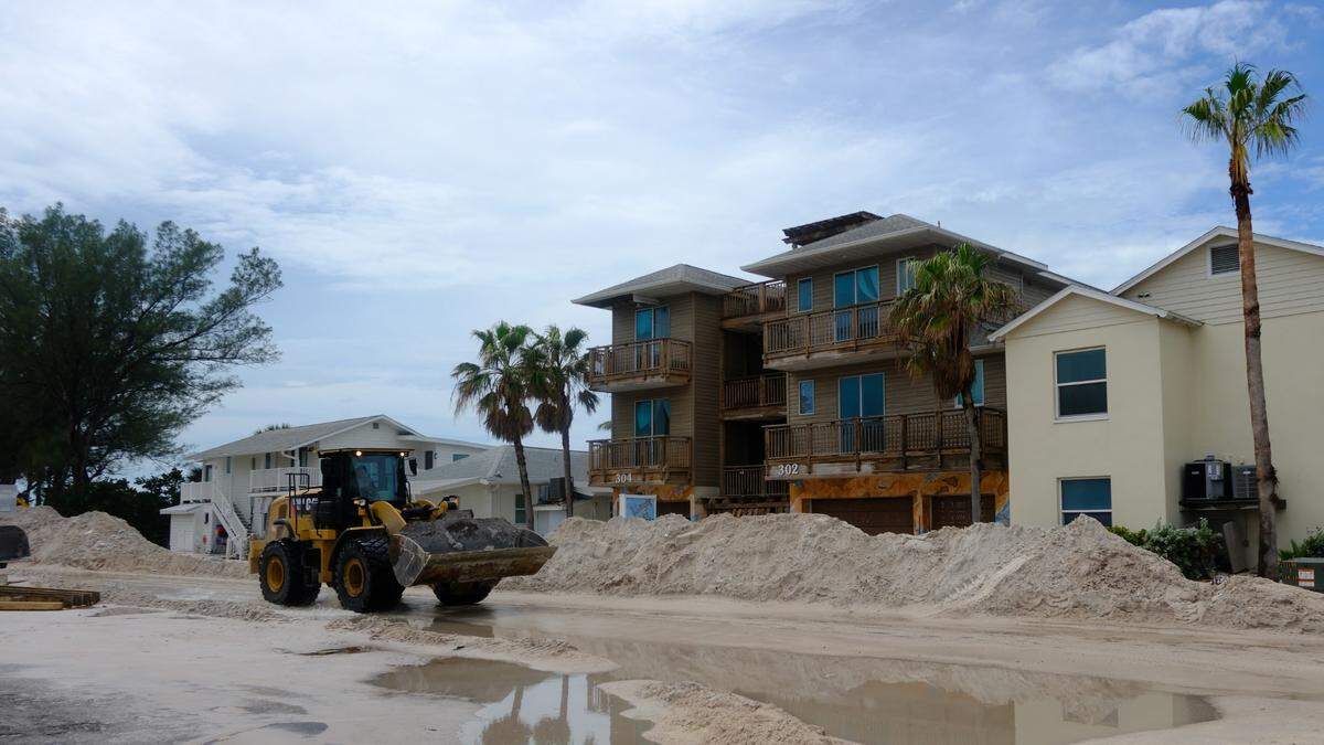 Bulldozers cleared feet of sand from Gulf Drive on Sat., Sept. 28, 2024, after Hurricane Helene battered Anna Maria Island as a powerful Category 4 storm.