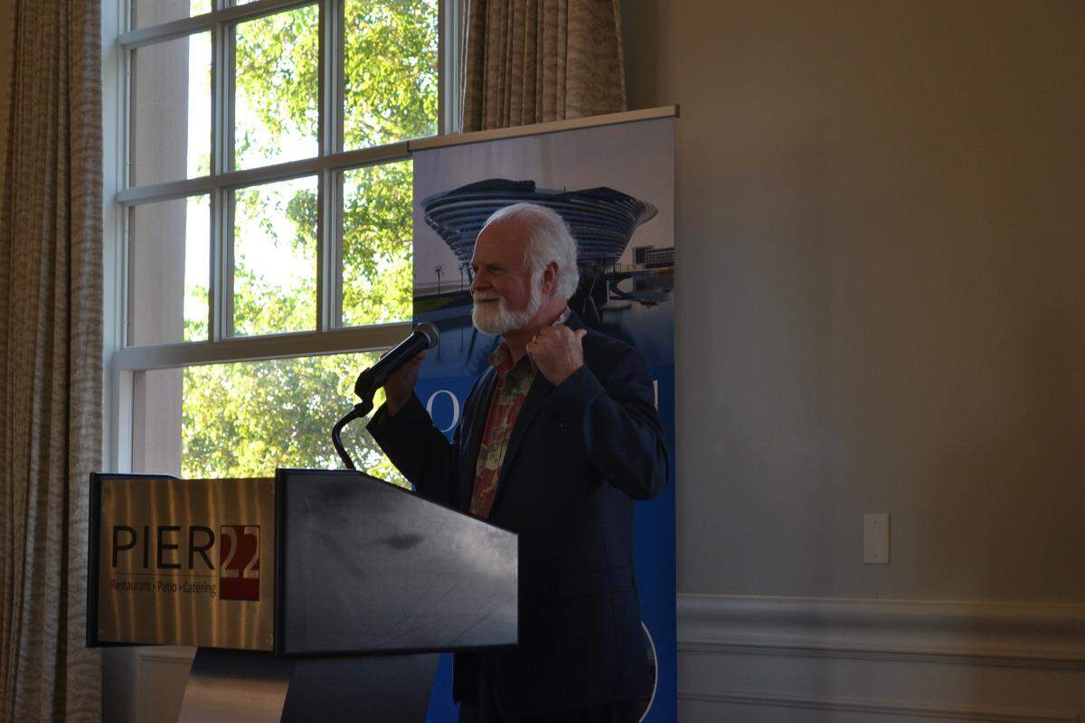 Michael Crosby, president and CEO of Mote Marine Laboratory and Aquarium, addresses a crowd of potential donors and community leaders at Pier 22 in Bradenton on Thursday night.