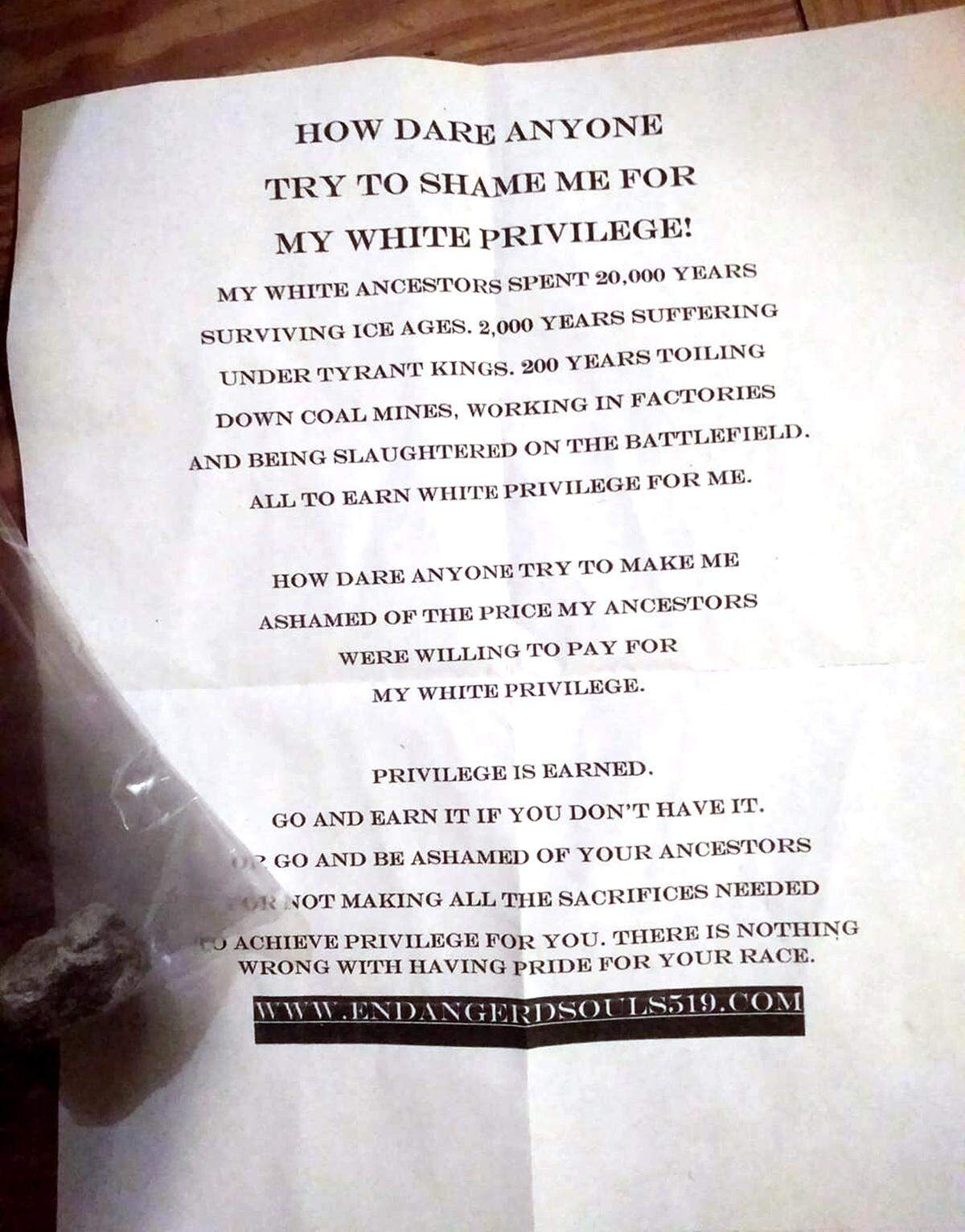A racist flyer was left in yards in a plastic bag with a rock at several homes in the Village of the Arts neighborhood.