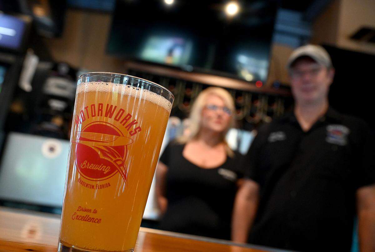 Desiree Chubb, director of quality and production at Motorworks Brewing in Bradenton, with Bob Haa, head brewer, have brewed a new beer using Florida hops.