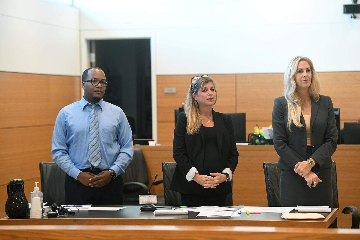 07/21/21—Quentin Peterson stands with his attorneys, Kaitlyn Statile and Daviana Braniff, before jury selection. Peterson, 28, is charged with two counts of possession of child pornography. If convicted as charged, Peterson faces up to 10 years in prison.