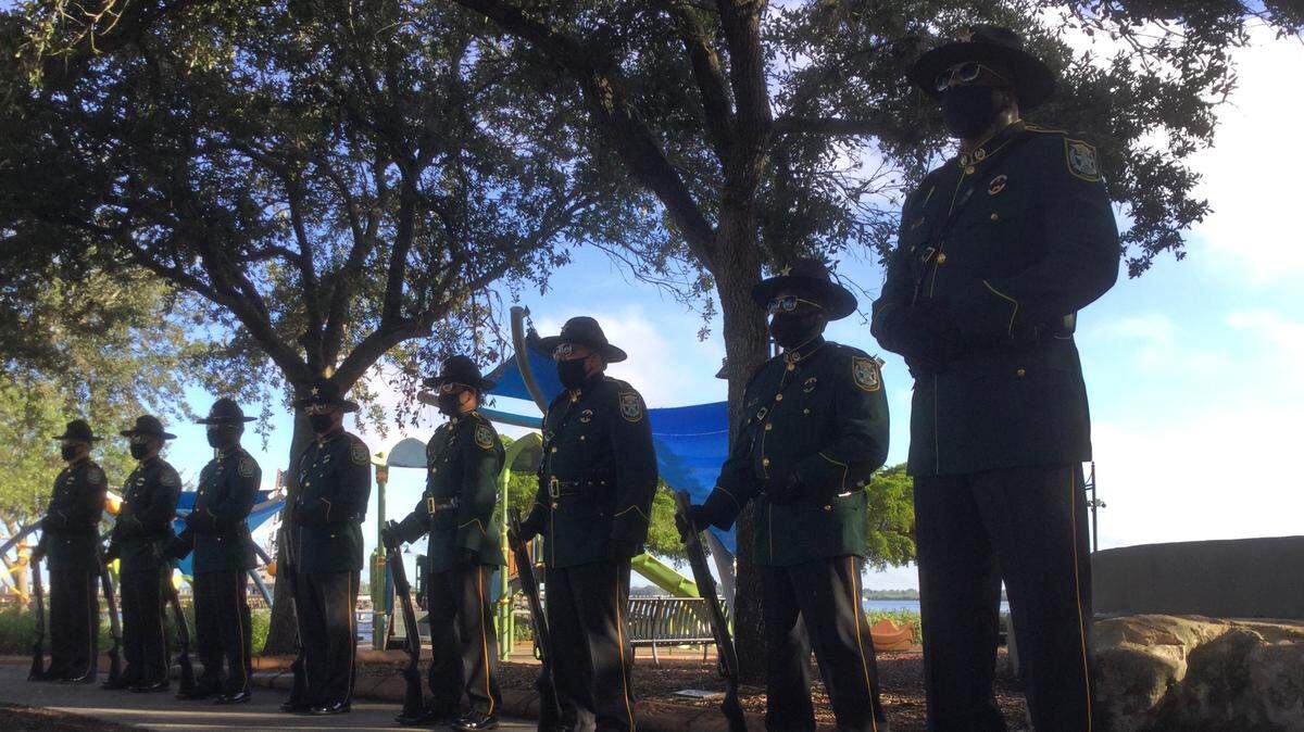 Members of the Florida Highway Patrol Honor Guard prepare to fire off a 21-gun salute to those who lost their lives 19 years ago in the terrorist attacks of 911.