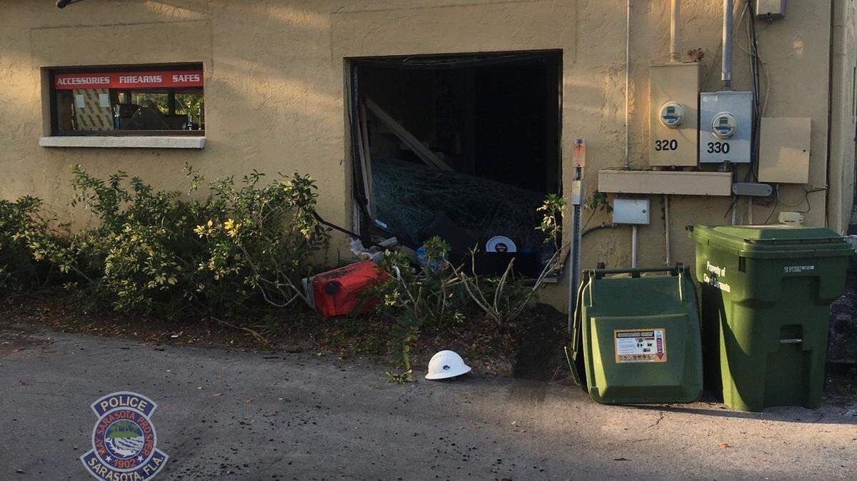 Sarasota police say a Palmetto teenager used a stolen car to crash into the side of a gun store in order to steal firearms.