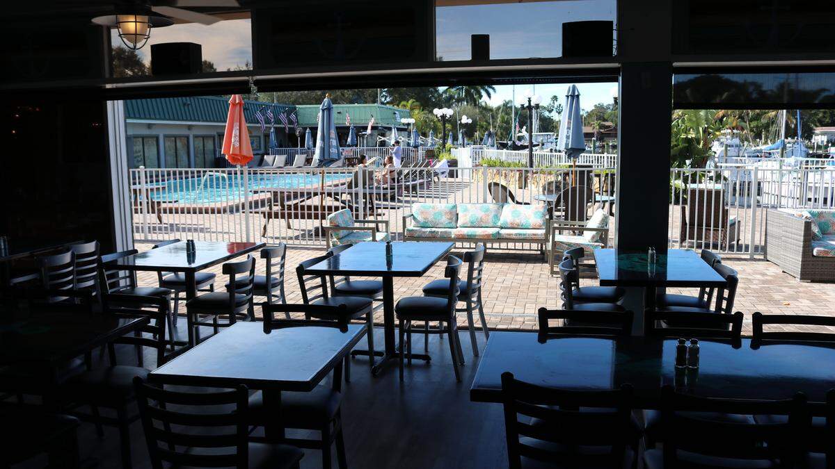 Tarpon Bay Grill looks out onto the swimming pool area, tiki bar, and Sarasota Bay. The business is located at 7150 N. Tamiami Trail.