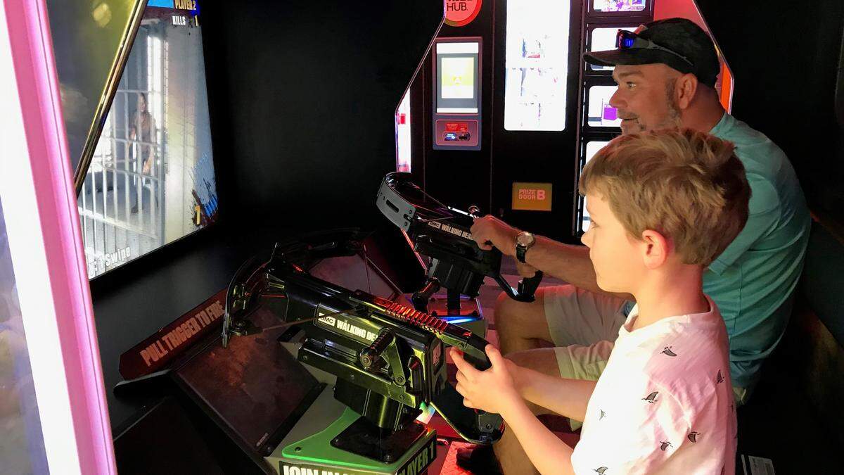David Brown and Jackson Mould play an arcade game at the Bradenton Bowlero, 4208 Cortez Road. The business has a grand opening on Saturday, April 6.