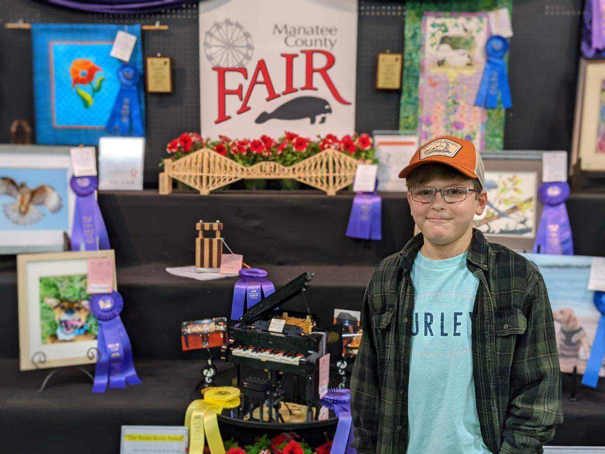 Brock Wallace, 10, poses with his award-winning entry in the 2021 arts and crafts exhibit at the Manatee County Fair.