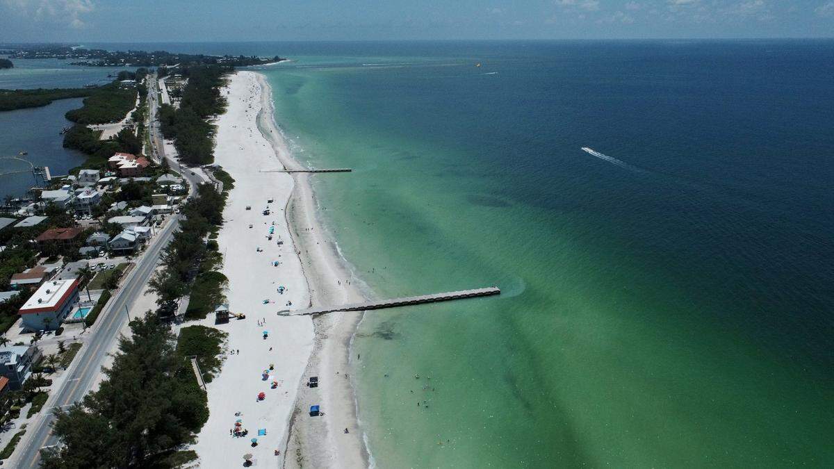 07/21/21-As a red tide bloom impacts Anna Maria Island, Manatee County Government staff are monitoring by air, land and sea. Local impacts from the bloom have been mild so far but could get worse. This view is from the area of Cortez Beach looking south towards Longboat Key.