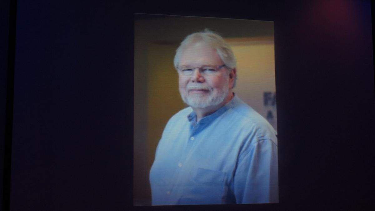 An image of the late Rick Fawley is projected onto a screen Wednesday evening at Goodwill Manasota's Ambassador of the Year Awards Dinner in Sarasota. Fawley was honored for his work in the community and for Goodwill. 
 AMARIS CASTILLO/Bradenton Herald