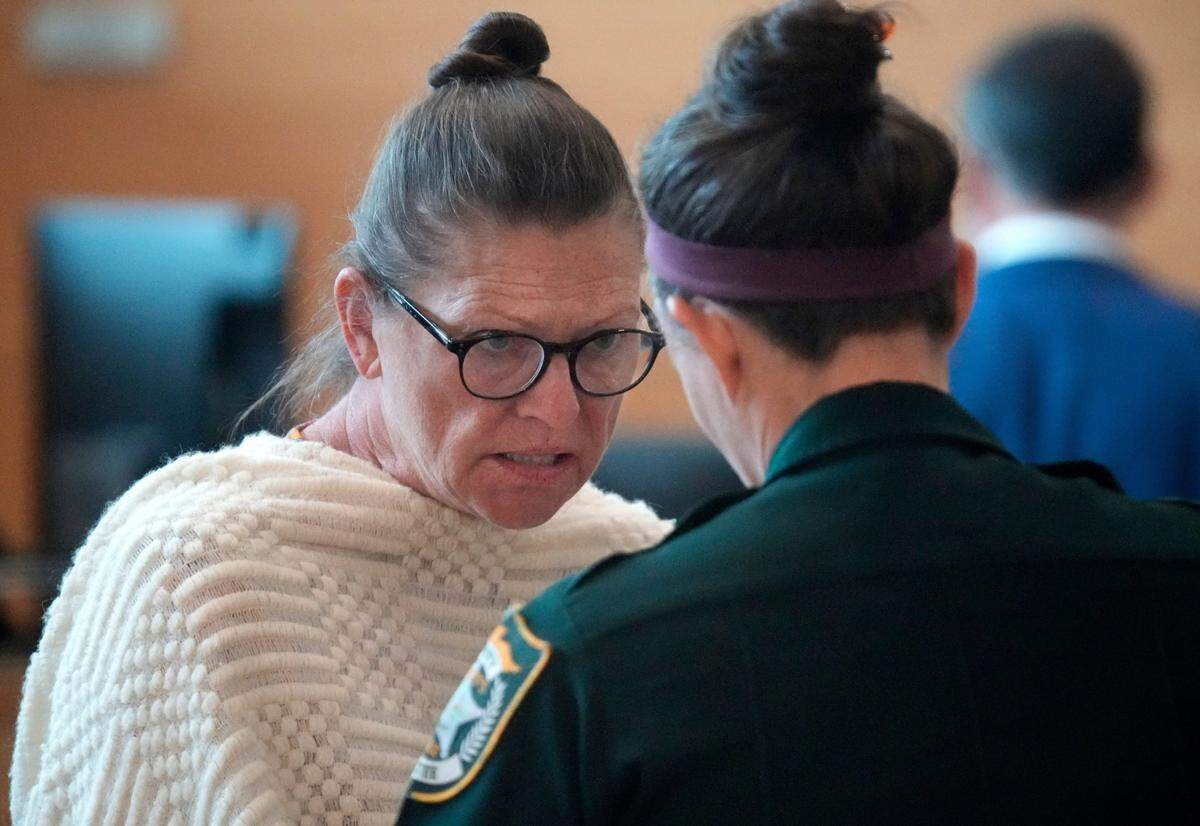 Teresa Zeppi talks to a baliff as she is removed from the courtoom during a break in the trial Wednesday morning in Bradenton. Zeppi is charged with leaving the scene of a crash involving injury or death for a crash on 9th Ave. NW that killed pedestrian Joseph Dralus, Sr. in 2020.