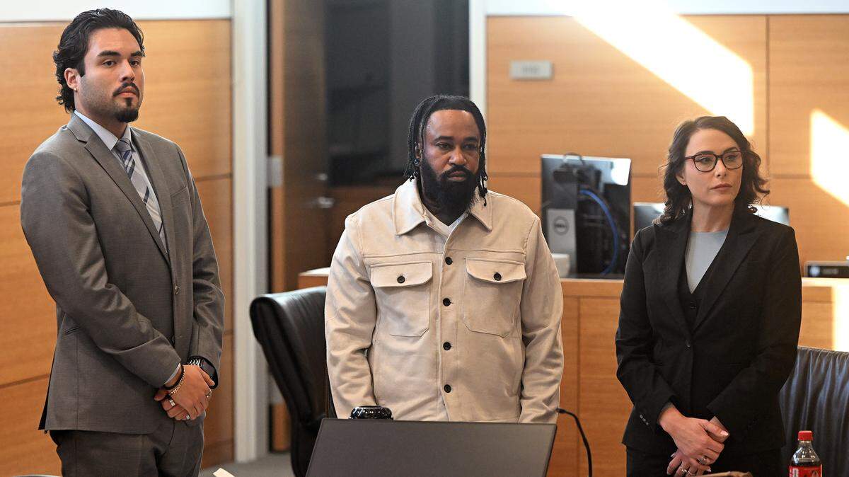Anthony Johnson, 39, appears in Manatee County Court ahead of his trial on three felony arson charges stemming from a 2023 fire at SeaPort Manatee, alongside his attorneys, Sebastian Mejia and Courtney Benson on Jan. 12, 2026. A jury found Johnson not guilty on all counts. 