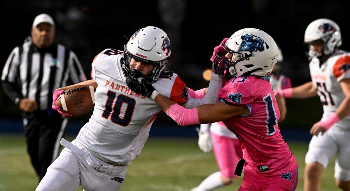 BCS’ Ben Bradshaw runs past ODA’s Tommy Orie at the Out of Door Academy field on Friday, Oct. 20, 2023.