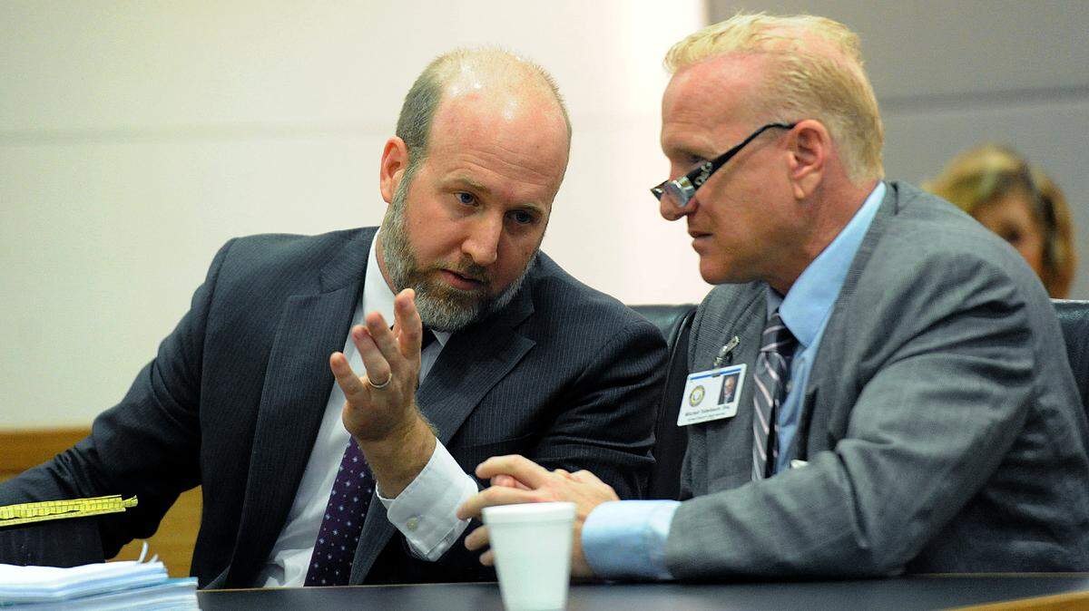 Manatee County School Board attorneys Fred Moore and Mitchell Teitelbaum confer during a hearing. The school board no longer will make public the reasons a student is expelled from schools. This action comes as more students are being expelled than have been in years.. 
 TIFFANY TOMPKINS/Bradenton Herald