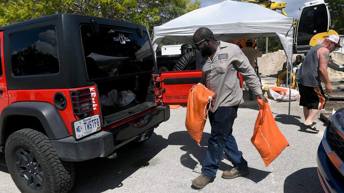 Sunday Manatee County Public Works employees filled sandbags and distributed them at G.T. Bray Park ahead of Tropical Storm Ian.