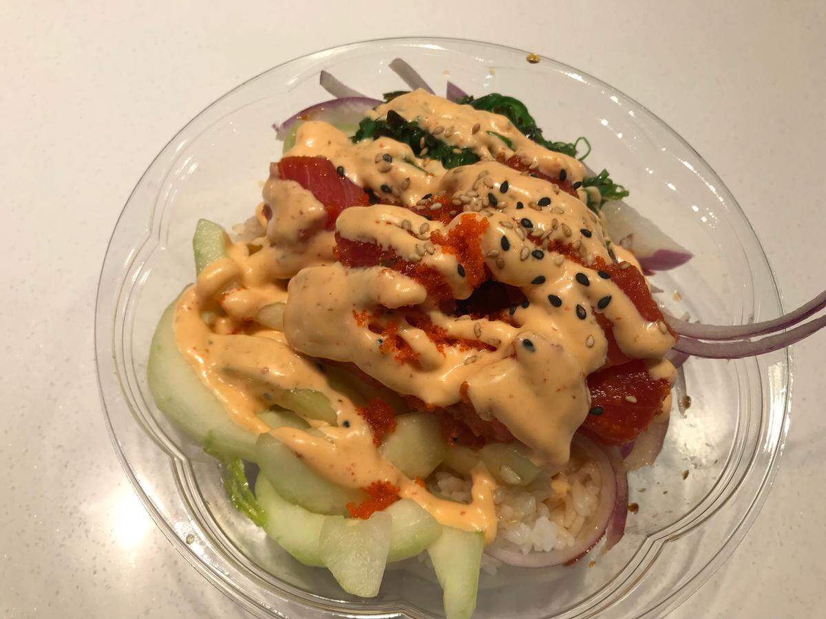 One of the popular menu items at Smilefin Poke is the “Crazy Tuna” poke bowl. It includes spicy tuna, cucumber, sweet onion, seaweed salad, masago, sesame seed Sriracha aioli, and house sauce for $11.