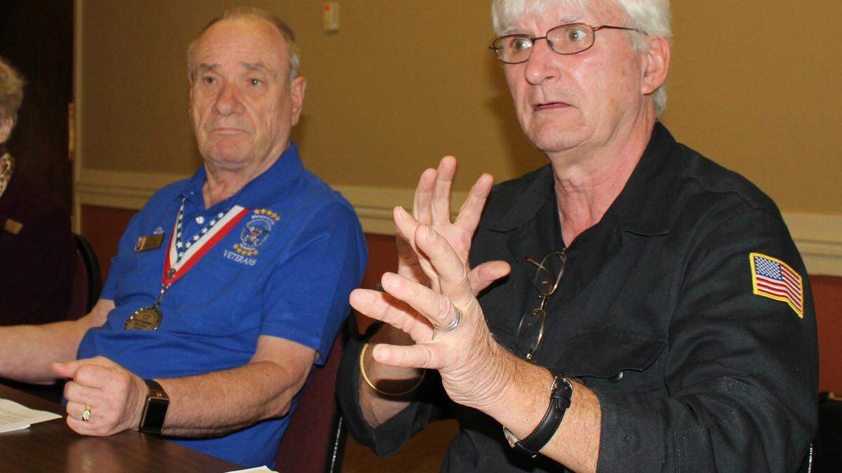 In January, members of the Manatee Veterans Council agreed to seek free bus rides for military veterans trying to get to Stand Down. Shown above at that meeting are Don Courtney, left, president of the Manatee County Veterans Council, and Andy Hooker of the Sarasota Veterans Council. 
 HERALD FILE PHOTO