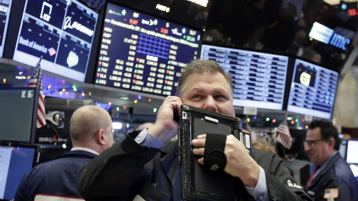 Trader George Ettinger works on the floor of the New York Stock Exchange, Friday, Dec. 4, 2015. Stocks posted solid gains Friday morning after the U.S. government reported another month of strong job gains. (AP Photo/Richard Drew)