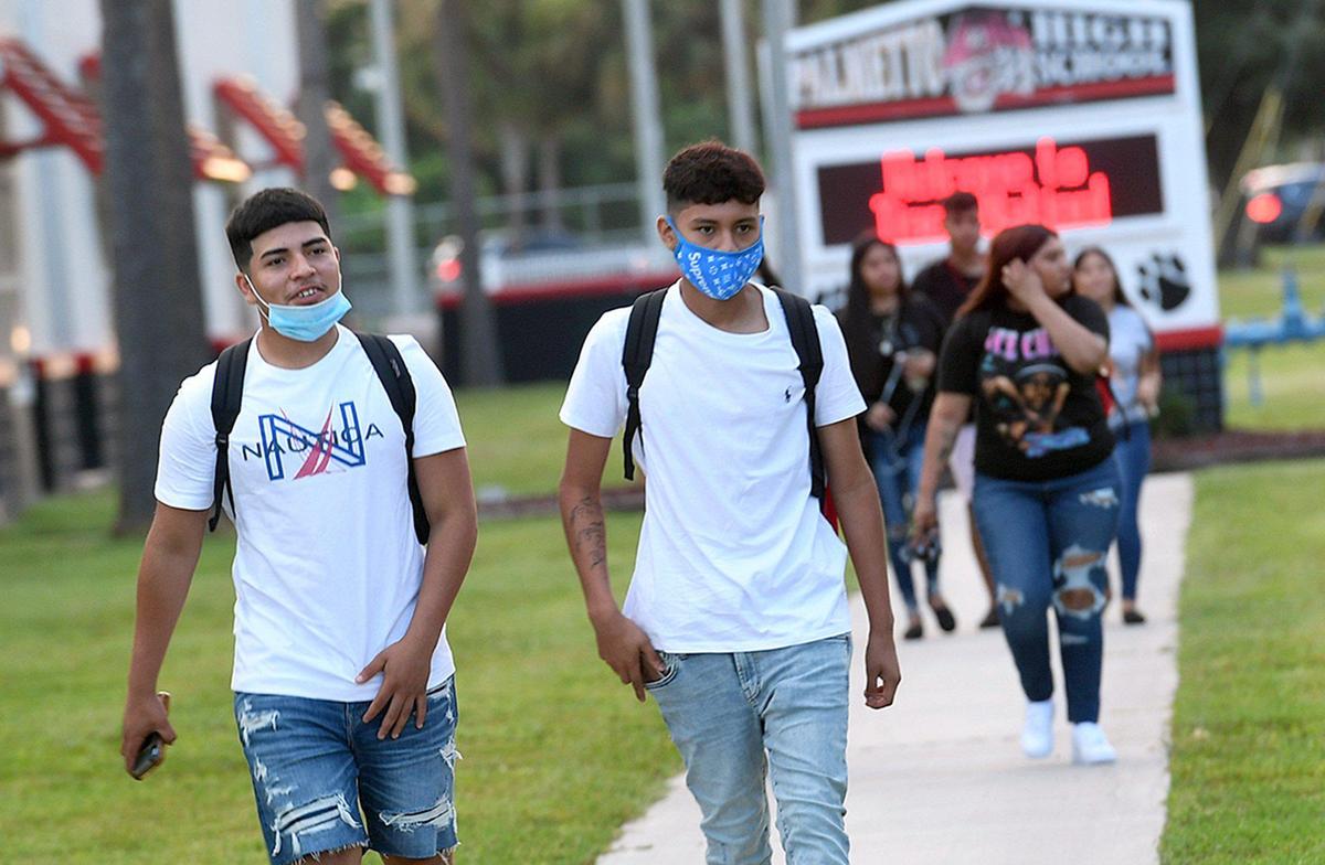 Palmetto High students in Manatee County returned to school with a new ‘normal’ of mask-wearing and social distancing.