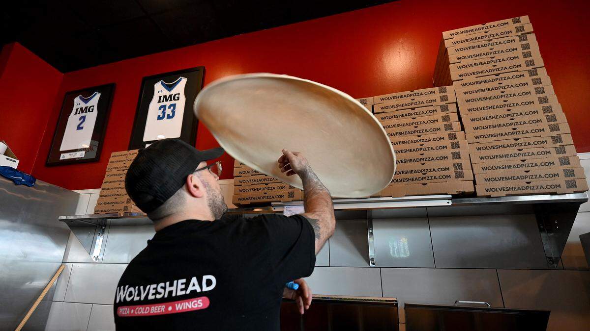 John Censullo Jr. throws pizza dough while making a pizza at the newly opened Wolveshead at 5348 34th St. W., Bradenton, shown on Friday, Oct. 17, 2025.