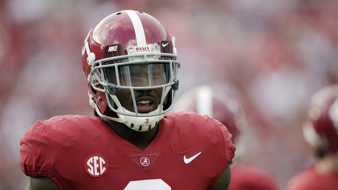 In this Saturday, Sept. 16, 2017, file photo, Alabama running back Bo Scarbrough walks the field before an NCAA college football game in Tuscaloosa, Ala. The Jacksonville Jaguars signed Scarbrough to their practice squad Thursday, Oct. 11, 2018 after the Dallas Cowboys cut him on Tuesday.
