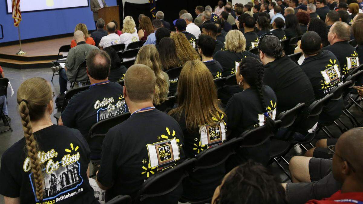 In this July 22, 2015 photo, Wal-Mart workers listen to speakers during a preview at a new distribution facility in Bethlehem, Pa. Just in time for the winter holiday shopping season, Amazon, Wal-Mart, Home Depot, Macyís and other retailers are working behind the scenes to make sure they can deliver online orders to shoppersí homes faster and cheaper. (AP Photo/Mel Evans)