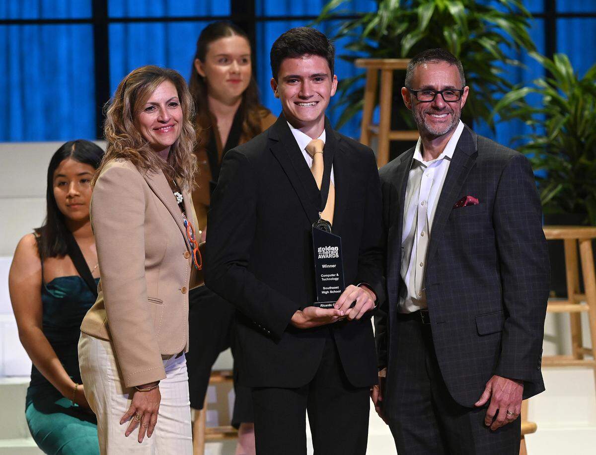 2023 Golden Herald Award winner in Computer Technology Ricardo Campbell with presenters Jackie Barron and Tom McDougal Thursday night.