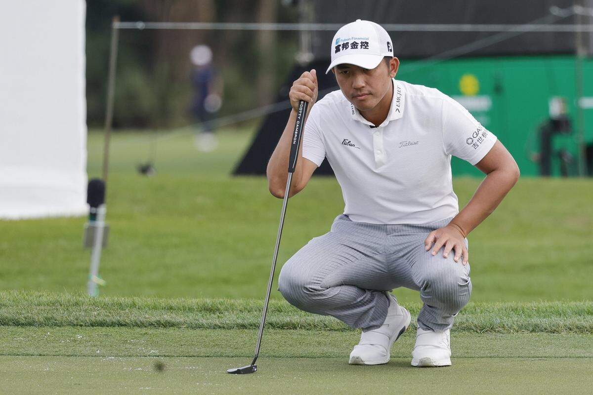 Feb 29, 2024; Palm Beach Gardens, Florida, USA;  CT Pan lines up his putt on the tenth green during the first round of the Cognizant Classic in The Palm Beaches golf tournament. Mandatory Credit: Reinhold Matay-USA TODAY Sports