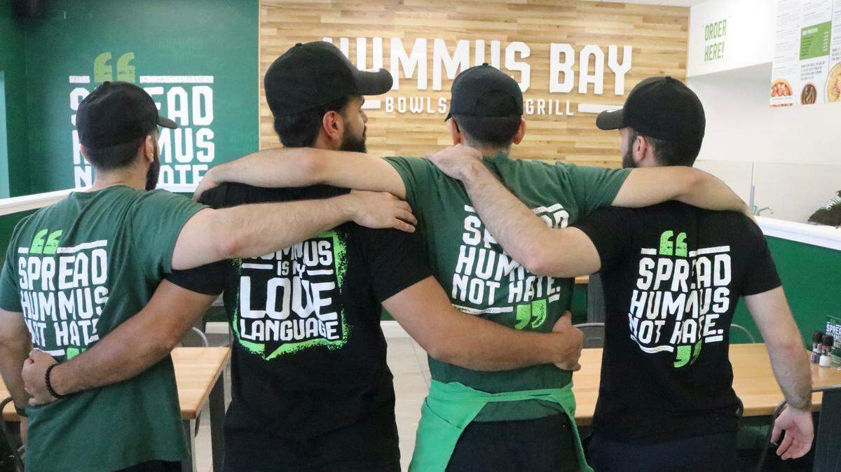 The staff at Hummus Bay, 7303 52nd Place E., in the Creekwood Crossing shopping center, shown March 17, 2022, wears distinctive green T-shirts.