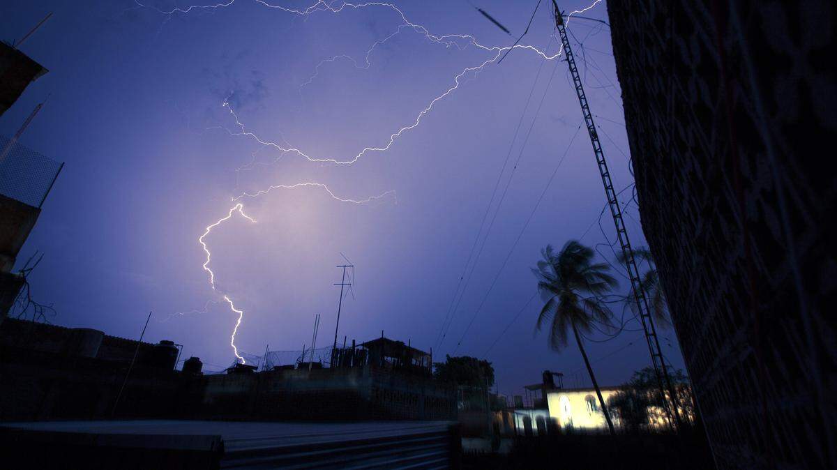 A roofer working on the roof of an apartment building was struck by lightning Tuesday.