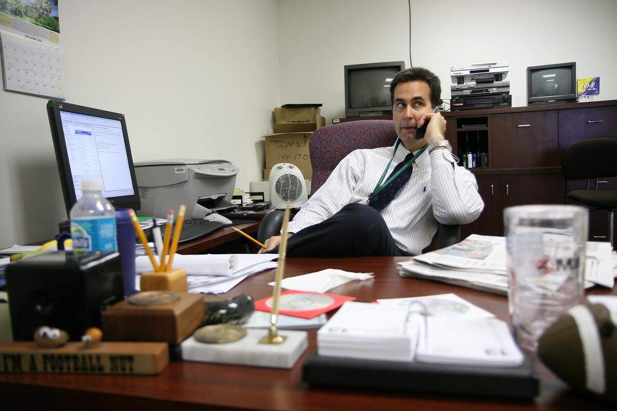 Manatee County Sheriff’s Office Public Information Officer Dave Bristow works the phones on March 13, 2007  as he answers a series of phone calls from media outlets inquiring about Sheriff Charlie Wells’ retirement.