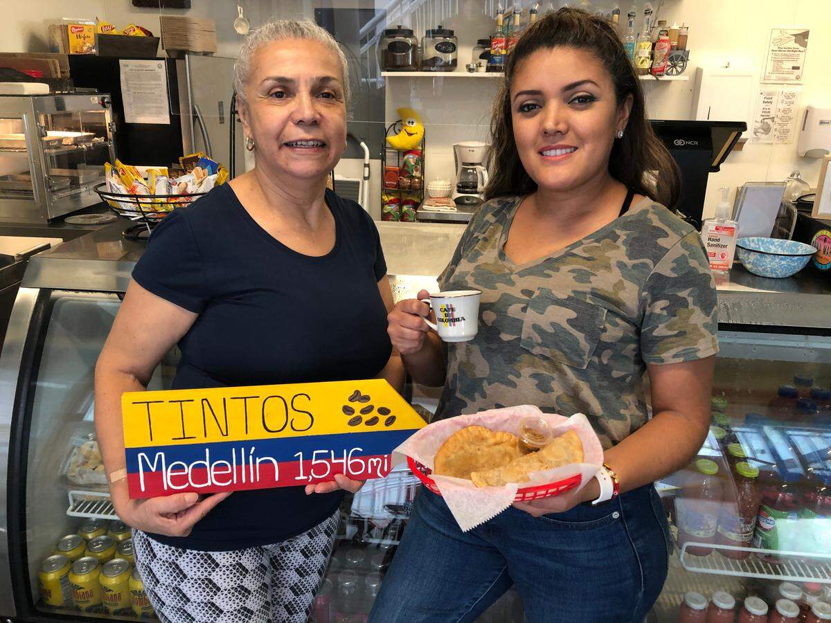3/24/2021--Sisters Nubia, left, and Veronica Betancourt opened Tintos in October at 119 Bridge St., Unit 130, in Bradenton Beach. The business features Colombian coffee and empanadas, and also serves a variety of sandwiches.
