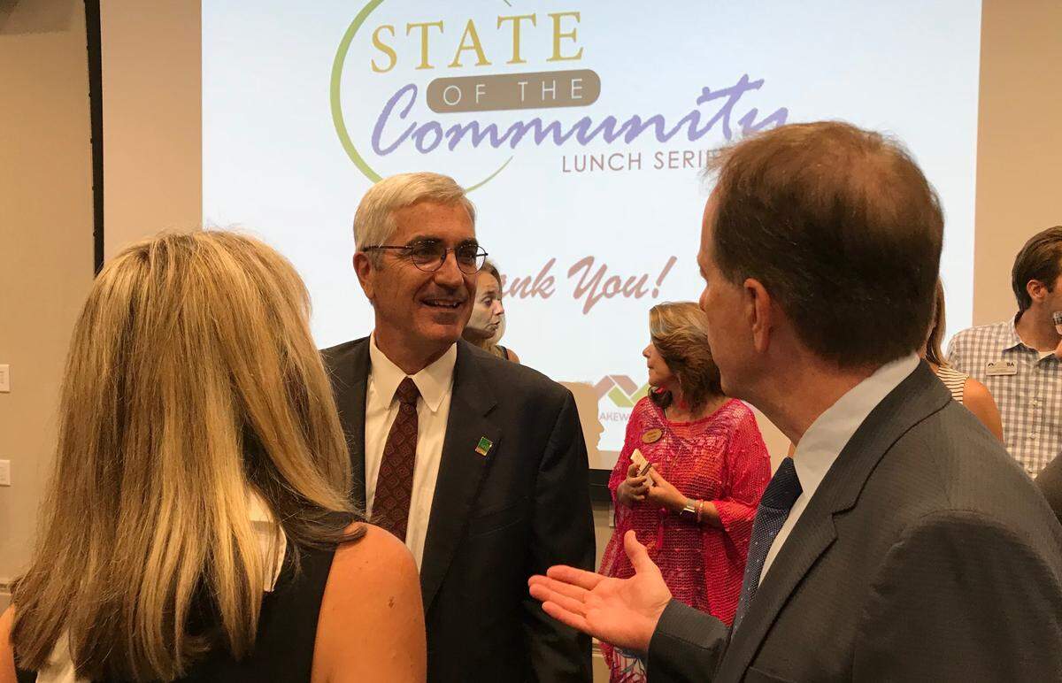Audience members gathered around Rick Piccolo, chief executive of Sarasota Bradenton International Airport, after his State of the Community Address on Wednesday.