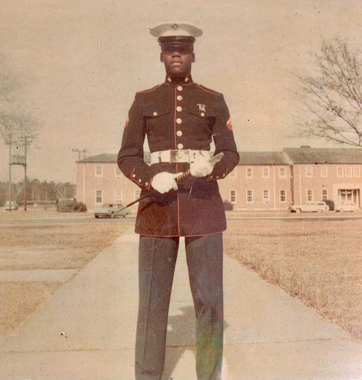 Edward Brown, left, enlisted in the Marines at age 17 and served in Vietnam, where he was wounded in action. He is returning to his old Palmetto neighborhood this week, distributing vouchers to residents for a special Thanksgiving he has planned.