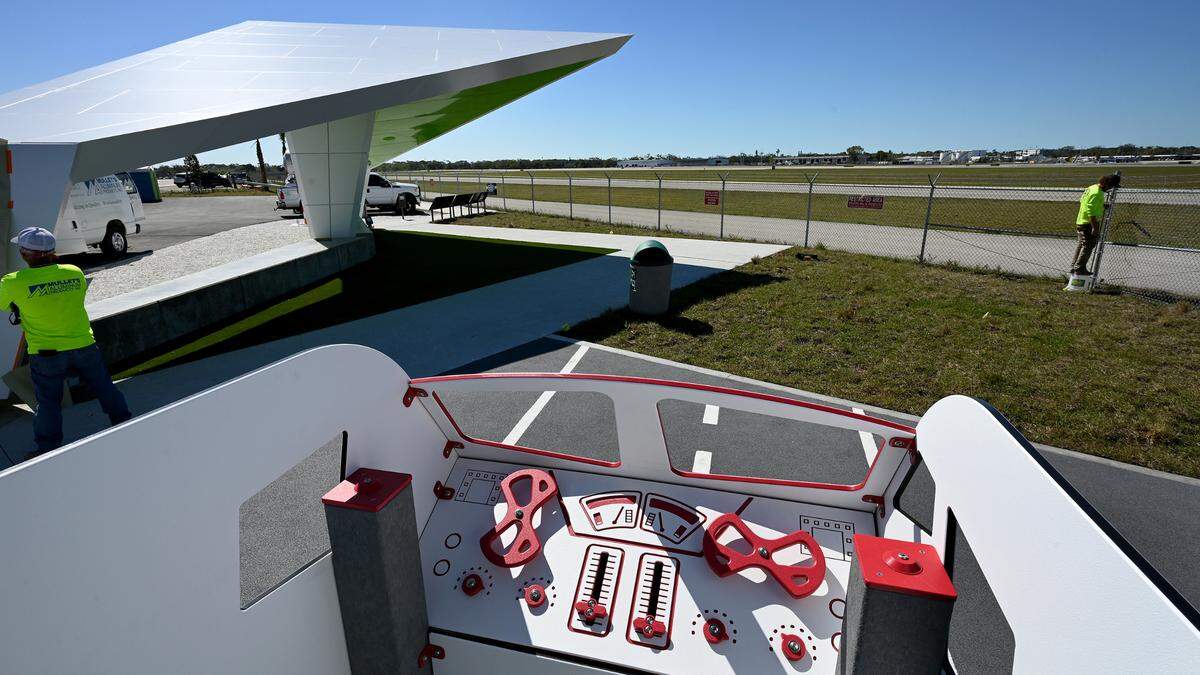 The Sarasota Manatee Airport Authority is having a ribbon-cutting for their new observation area at 8330 15th Street East, Sarasota, on March 12. Workers finish up last minute preparations on March 11.