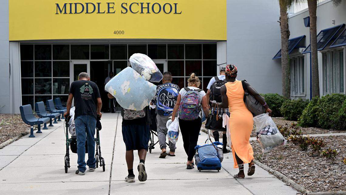 Evacuees arrive at Electa Arcotte Lee Middle School’s evacuation shelter as Hurricane Helene approaches Manatee County on Wednesday, Sept. 25, 2024.