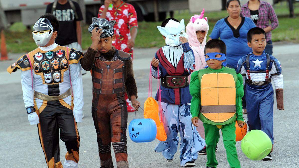 File photo: Costumed families arrive at the Manatee County Fairgrounds in Palmetto for the CrimeStoppers Halloween Safe Kids Night.