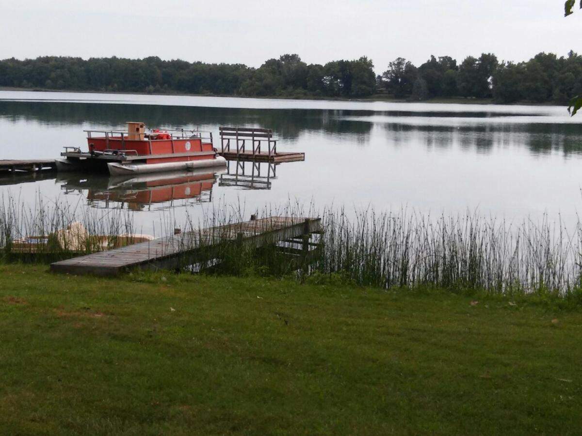The Eicher family is making good use of a pontoon boat during their time at the lake.