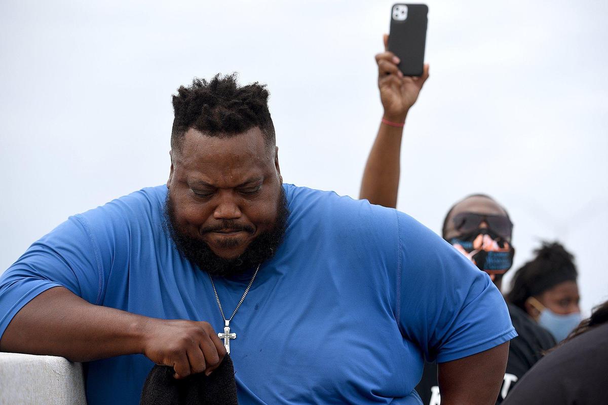 During a march called One Love, One Nation, One Heart, marchers took a knee on the pinnacle of the Green Bridge in remembrance of George Floyd. The group of about 200 made their way from Bradenton to Palmetto where they had speeches for racial justice and music.