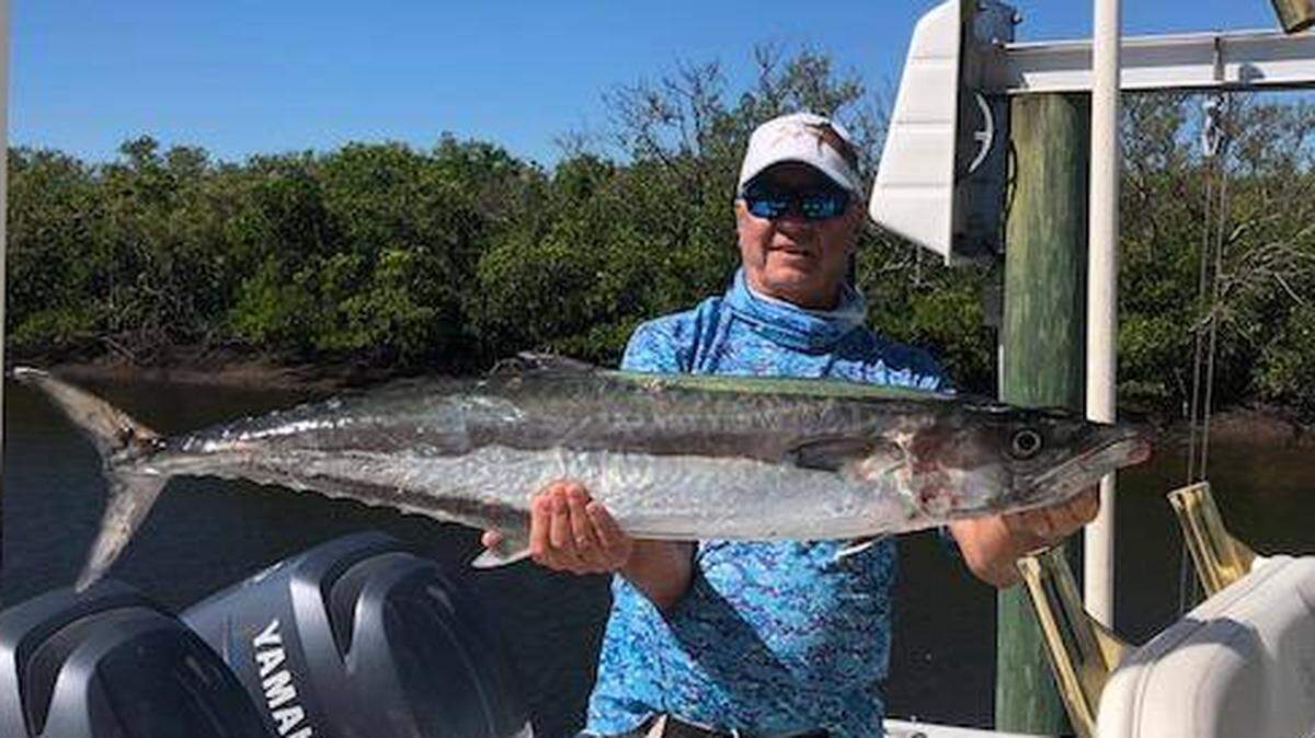 Rick Uffalussy shows off a large kingfish caught in the past week on light tackle.