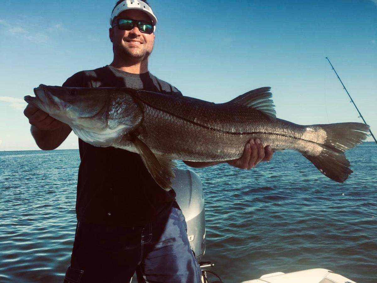 A member of Team Richardson Stinton Roofing powered by Skeeter Boats poses with a 40-inch snook.