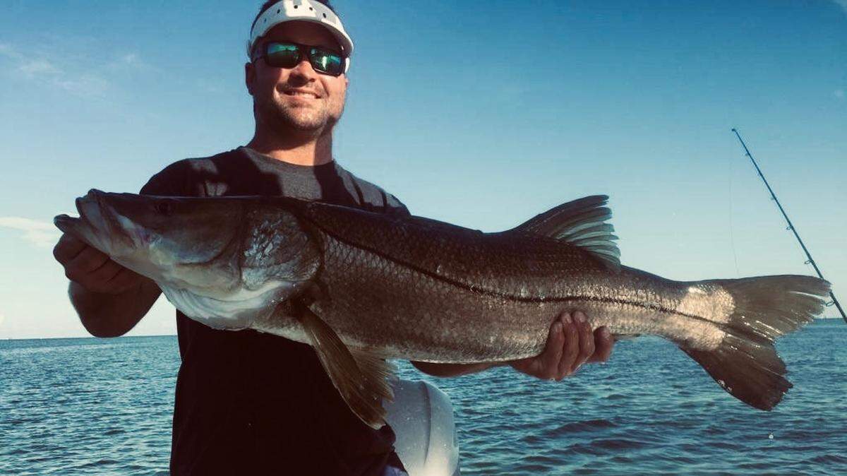 A member of Team Richardson Stinton Roofing powered by Skeeter Boats poses with a 40-inch snook.