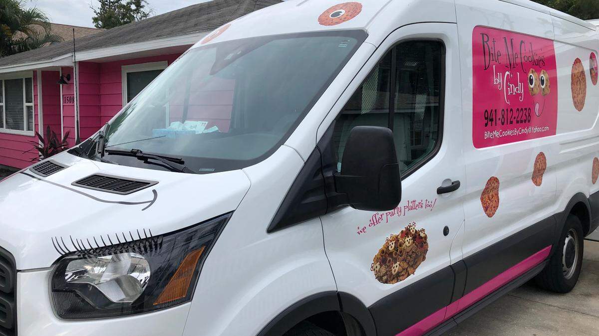 Cindy Unzicker’s cookie van has distinctive signage and eyelashes. She delivers cookies to about one dozen neighborhoods a month.