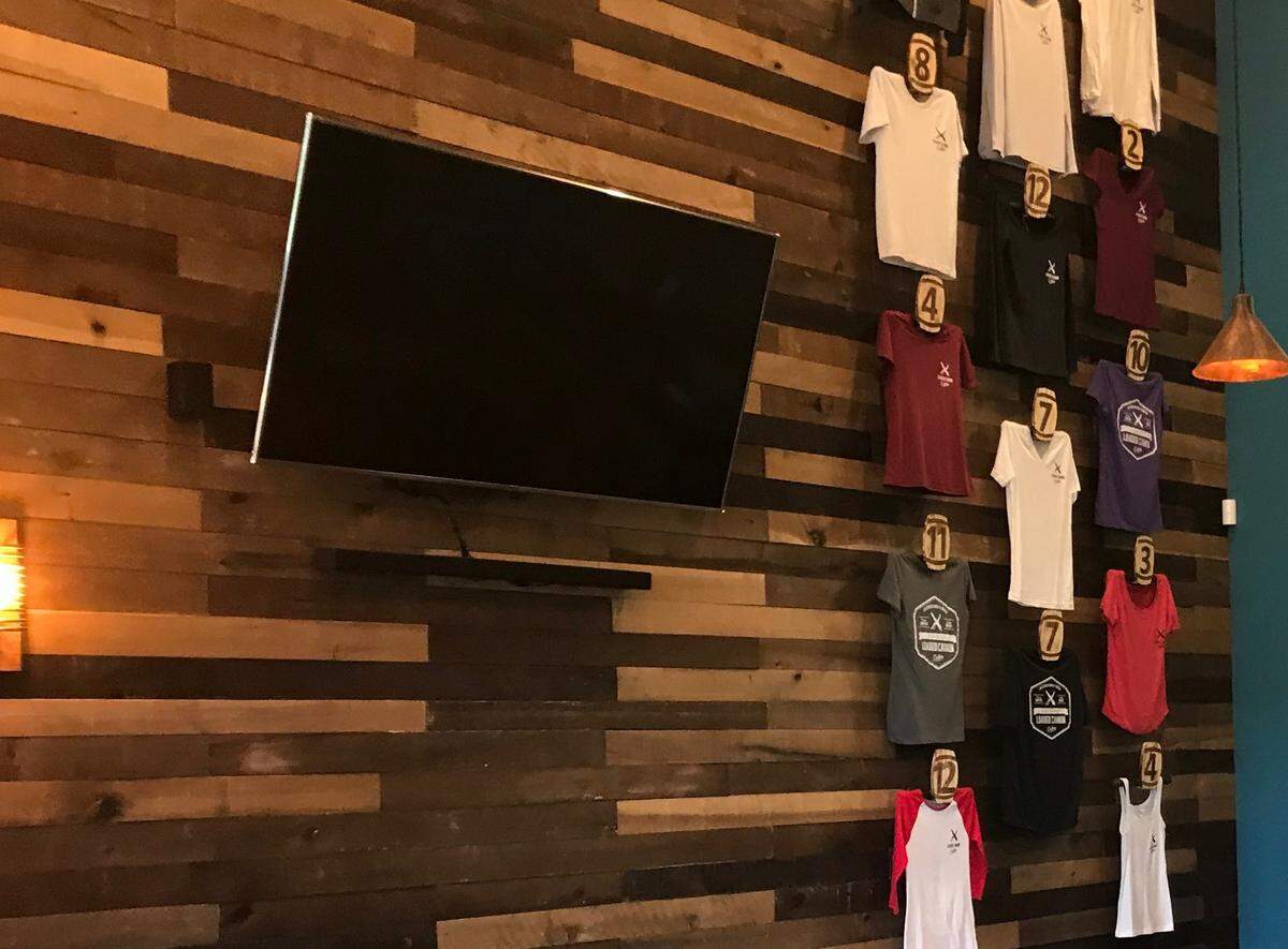 Among the souvenirs offered at Loaded Cannon Distillery are T-shirts, shown above, hats, glassware and more.