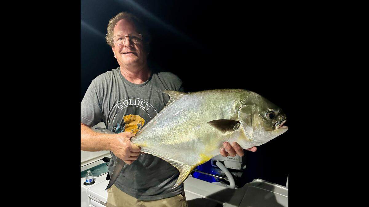 Bill Harris poses with one of the eight permit caught during a night fishing shrimp in the Gulf of Mexico off Anna Maria Island ahead of Hurricane Idalia.