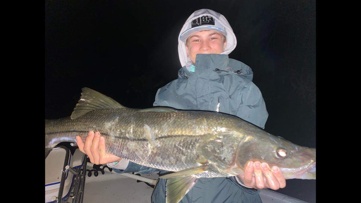 11-year-old Dallas Thompson poses with a 36.75-inch snook he caught during the 35th Annual Johnny Kellar Fishing Tournament. It was the largest snook caught by any competitor, including the adults.
