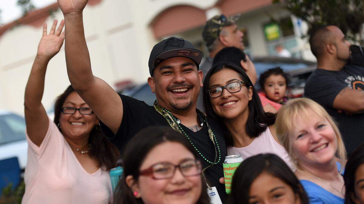 The crowds wave and scream with excitement at the annual DeSoto Grand Parade Saturday. 
 TIFFANY TOMPKINS/Bradenton Herald
