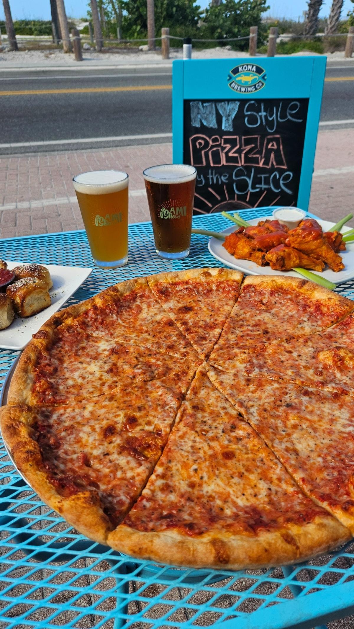 Guests at Wilder’s Slice of AMI, 103 Gulf Drive N., Bradenton Beach, may sit inside the dining room or take advantage of sidewalk seating facing onto beach dunes and the Gulf of Mexico.