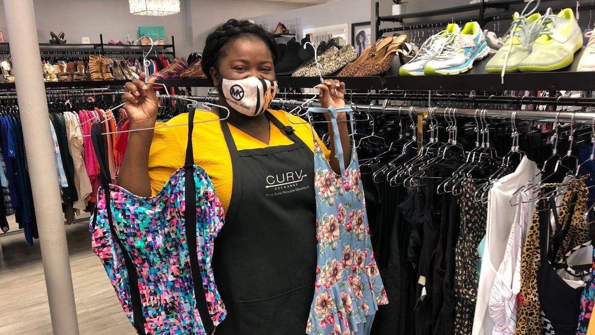 4/14/2021--Britanny Brooks shows several swim suit selections available at Curv Exchange Plus Size Resale Boutique, 5165 14th St. W., Bradenton.