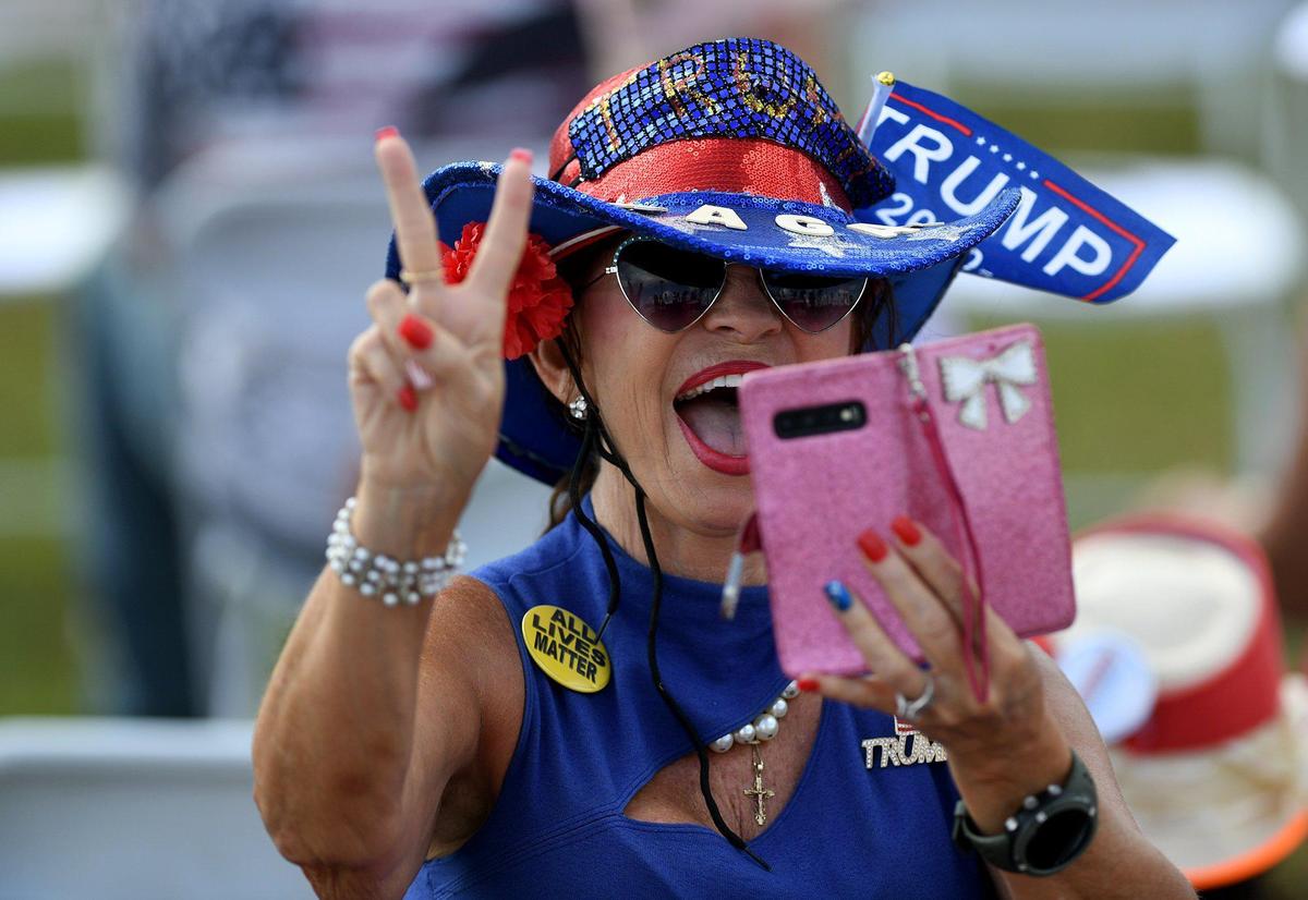 A supporter takes a selfie video before Ivanka Trump speaks to a crowd at a Trump rally at Nathan Benderson Park in Sarasota Tuesday afternoon