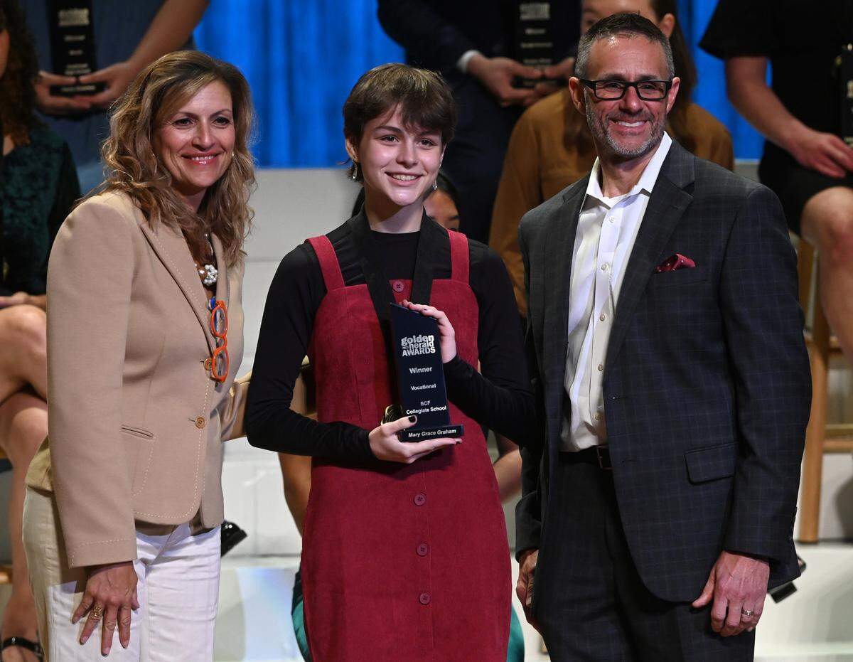 2023 Golden Herald Award winner in the Vocational category Mary Grace Graham with presenters Jackie Barron and Tom McDougal Thursday night.